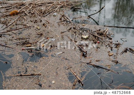 Garbage floating in water 48752668