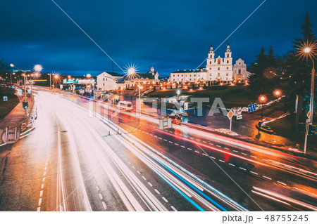 Minsk, Belarus. Night Traffic On Illuminated Street And Cathedral Of Holy Spirit In Minsk. Famous Minsk, Belarus. Night Traffic On Illuminated Street And Cathedral Of Holy Spirit In Minsk. Famous 48755245