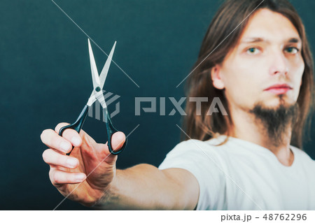 Hairstylist with scissors in hand 48762296