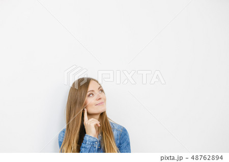 Beautiful young lady with denim jacket. 48762894