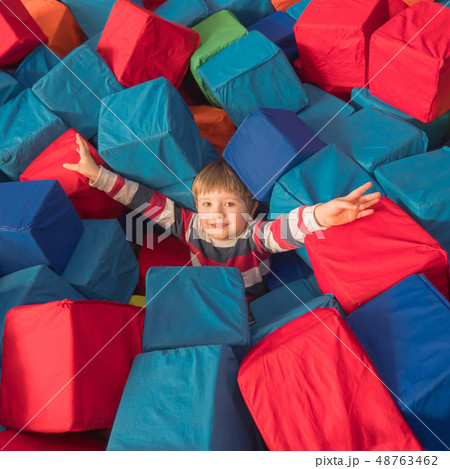 Happy childhood concept. Boy playing with soft Happy childhood concept. Boy playing with soft 48763462