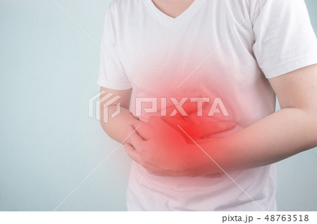 Asian Young men are suffering from stomach ulcers. 48763518