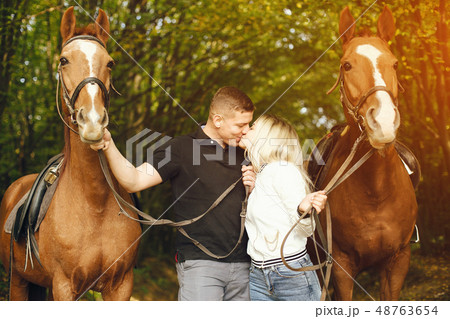 couple with horses 48763654
