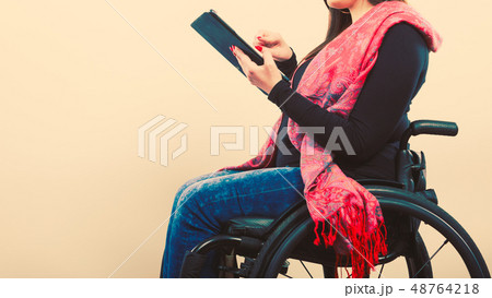Disabled student with tablet ebook. Disabled student with tablet ebook. 48764218