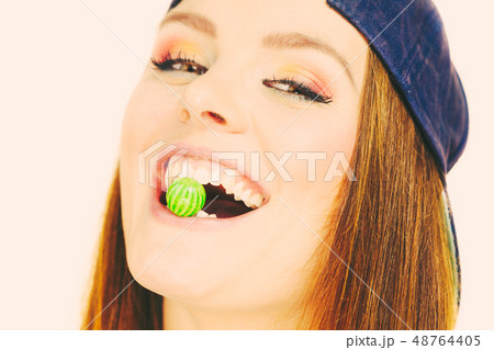 Girl with chewing gum. 48764405