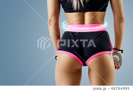 Athletic woman demonstrated her perfect muscular buttocks. 48764995