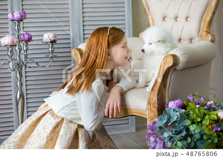 Portrait of ginger hair girl play with husky poppy Portrait of ginger hair girl play with husky poppy 48765806
