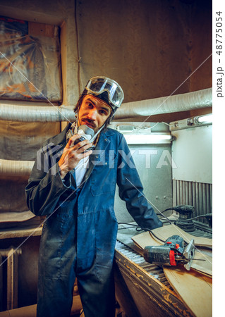 Portrait of serious professional carpenter Portrait of serious professional carpenter 48775054