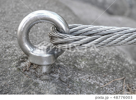 Stainless cable fixed to the rock for the safety Stainless cable fixed to the rock for the safety 48776003