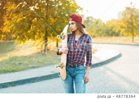Pretty woman in shirt and jeans 48778364