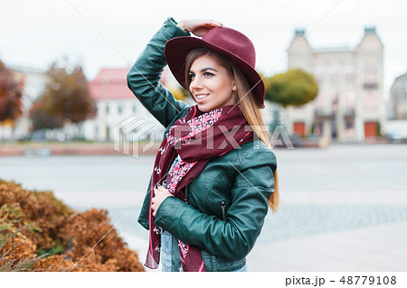 Beautiful fashionable girl posing in the city 48779108