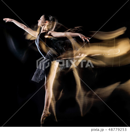 young woman ballerina  dancer dancing isolated black background light painting 48779253