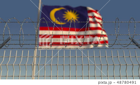 Barbed wire against waving flag of Malaysia. 3D rendering 48780491