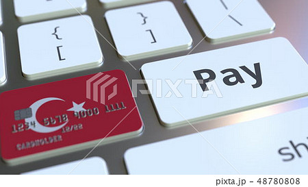 Bank card featuring flag of Turkey as a key on a computer keyboard. Turkish online payment 48780808