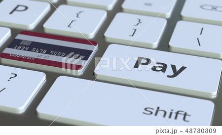 Bank card featuring flag of Thailand as a key on a computer keyboard. Thai online payment conceptual 48780809