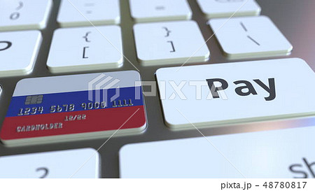 Bank card featuring flag of Russia as a key on a computer keyboard. Russian online payment 48780817