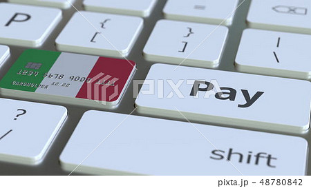 Bank card featuring flag of Italy as a key on a computer keyboard. Italian online payment conceptual 48780842