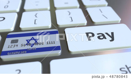 Bank card featuring flag of Israel as a key on a computer keyboard. Israeli online payment 48780843