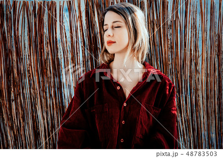 Sad woman sitting near window and shadows 48783503
