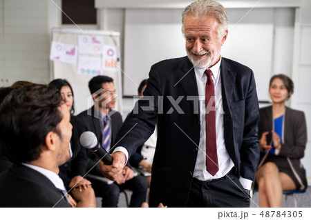 Senior leader speaker speaks to people audience. Senior leader speaker speaks to people audience. 48784305