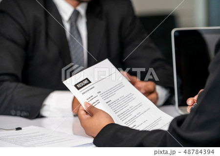Human resources department manager reads CV resume Human resources department manager reads CV resume 48784394