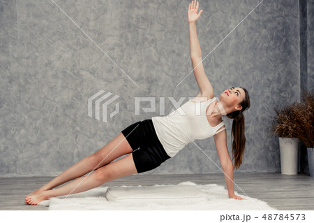 Young woman yoga on carpet at home living room. Young woman yoga on carpet at home living room. 48784573
