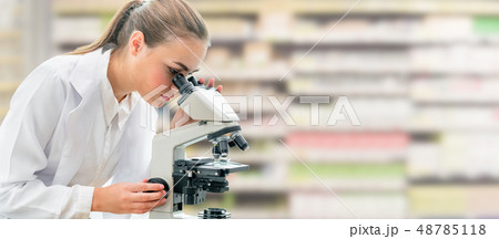 Scientist researcher uses microscope in laboratory Scientist researcher uses microscope in laboratory 48785118
