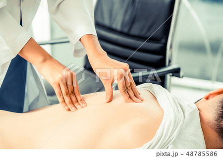 Woman Doctor and Male Patient in Hospital Office 48785586