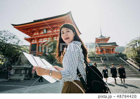 visitor holding guide paper visit kiyomizu temple visitor holding guide paper visit kiyomizu temple 48794420
