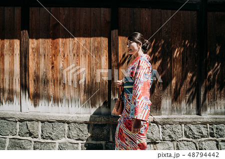 side view of young local girl pink floral kimono side view of young local girl pink floral kimono 48794442