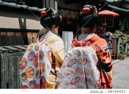 maiko geisha walking on a street of Gion maiko geisha walking on a street of Gion 48794455