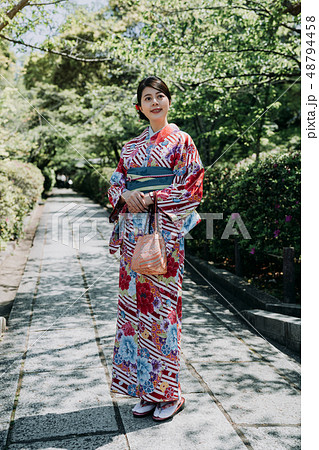 gorgeous woman in path stand in japanese garden gorgeous woman in path stand in japanese garden 48794458