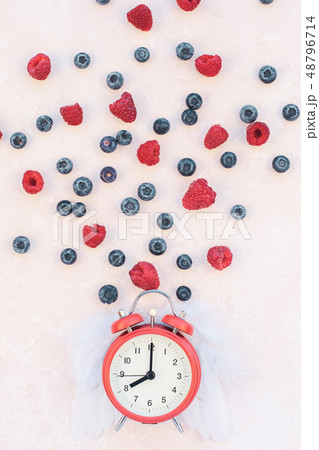 Valentine Day composition berries alarm clock 48796714