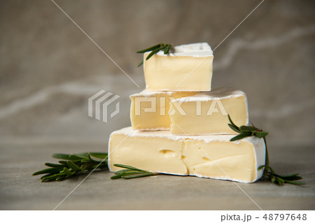 Cheese camembert or brie with fresh rosemary 48797648