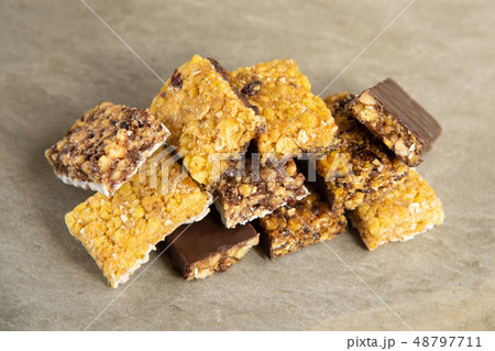 Various muesli bars on marble stone background Various muesli bars on marble stone background 48797711