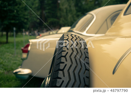 Yellow vintage cars on the grass Yellow vintage cars on the grass 48797790