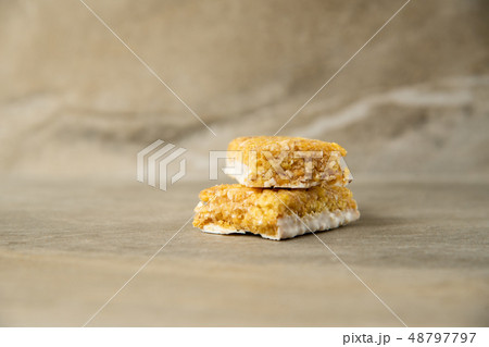 Muesli and cereal bar on marble stone background 48797797