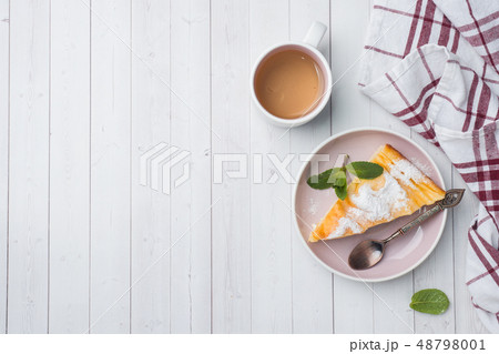 Cottage cheese casserole on a plate with powdered Cottage cheese casserole on a plate with powdered 48798001