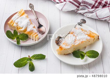 Cottage cheese casserole on a plate with powdered  48798010