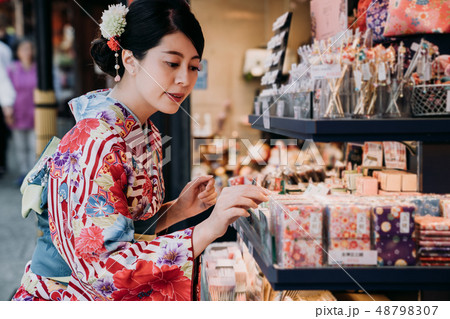 japanese lady wearing kimono buying handkerchief japanese lady wearing kimono buying handkerchief 48798307
