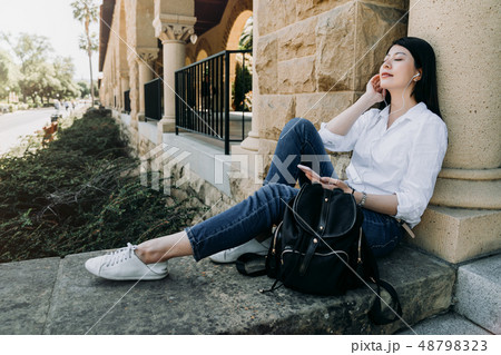 student listening to music relaxing close eye student listening to music relaxing close eye 48798323
