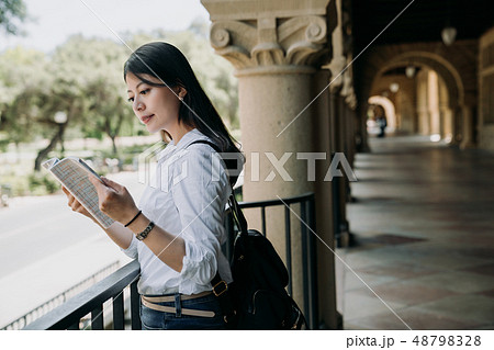 student woman reading textbook 48798328