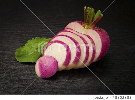 red turnip over black background 48802383