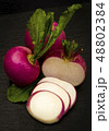 red turnip over black background 48802384