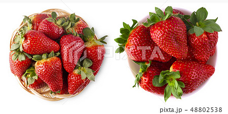The wicker brown basket with strawberries isolated The wicker brown basket with strawberries isolated 48802538