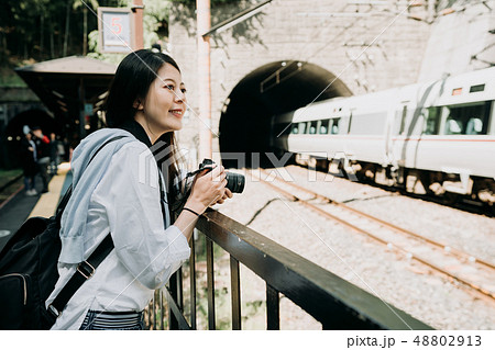 girl backpacker outdoor near the railway cave. girl backpacker outdoor near the railway cave. 48802913