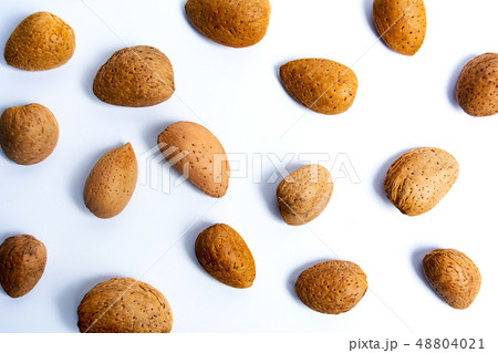 Fresh almonds on white flat lay Fresh almonds on white flat lay 48804021