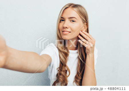 a beautiful girl dressed in a white t-shirt a beautiful girl dressed in a white t-shirt 48804111