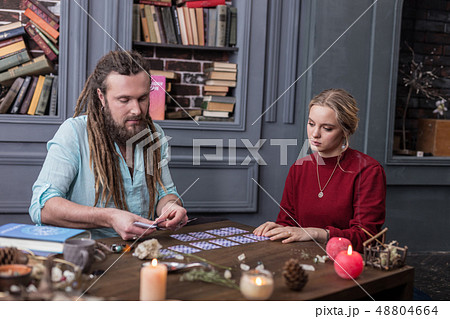 Pleasant serious man putting cards on the table 48804664