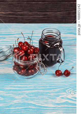 Cherry juice with glass of berries 48805142